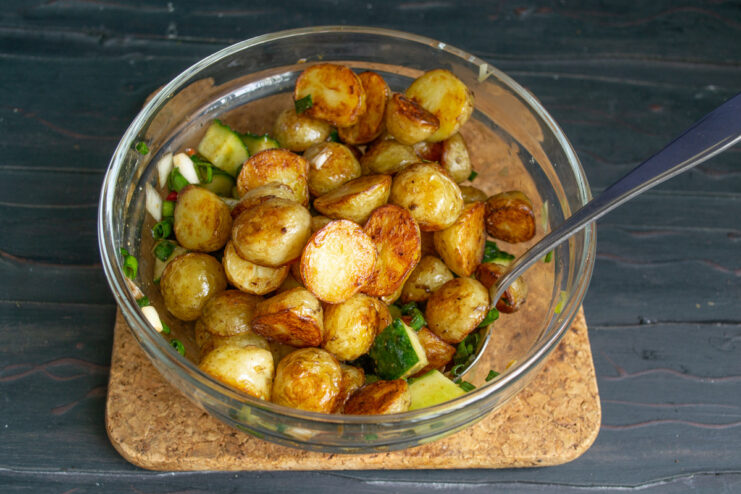 Letting the Vegetables Macerate A bowl of cucumbers and onions marinating in soy sauce dressing.