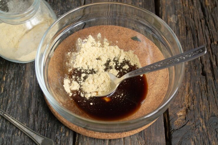 Adding a spoonful of dried ginger powder to the soy sauce and honey mixture.