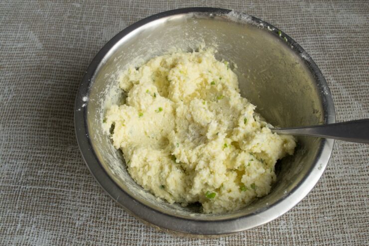 The final dough for lazy varenyky being mixed in a white bowl.