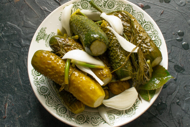 The Perfectly Fermented Malosolnye Ogurtsy are Ready! A bowl of finished, crunchy lightly salted cucumbers with mustard powder, ready to be served.