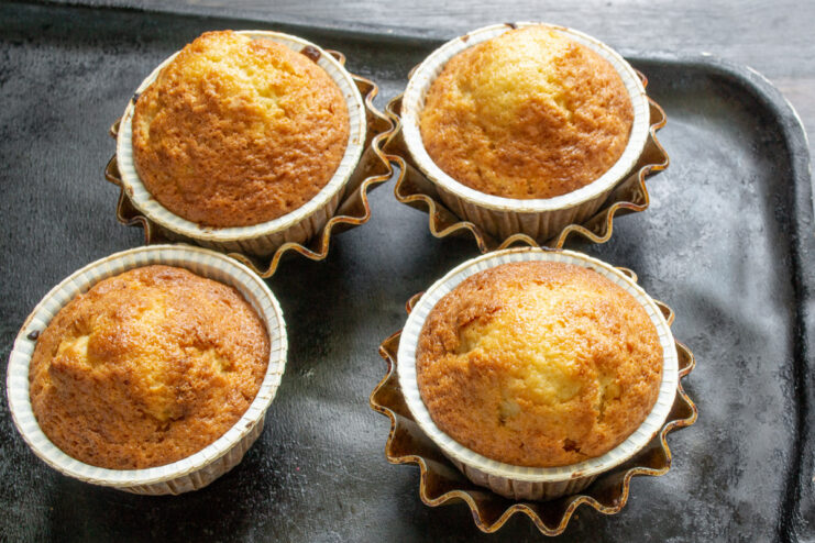 Step 8: Baking the Carrot Cupcakes Until Golden A muffin tin with carrot cupcakes baking in the oven.