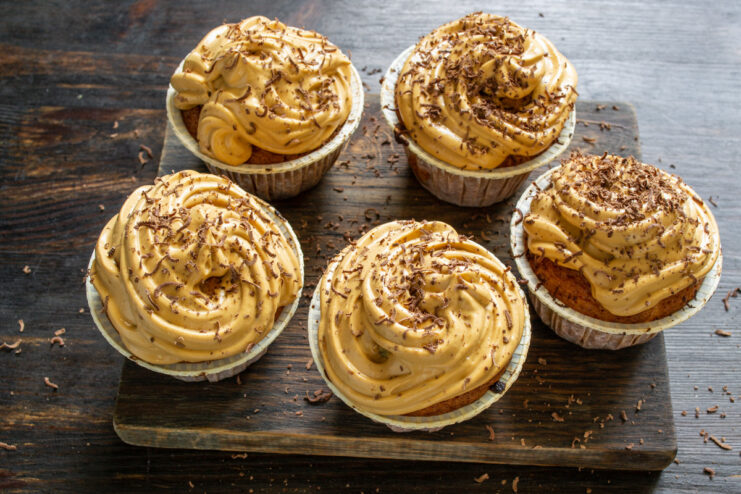 Final Step: Chilling the Decorated Cupcakes Before Serving Finished carrot cupcakes with caramel cream, garnished and ready to be chilled.