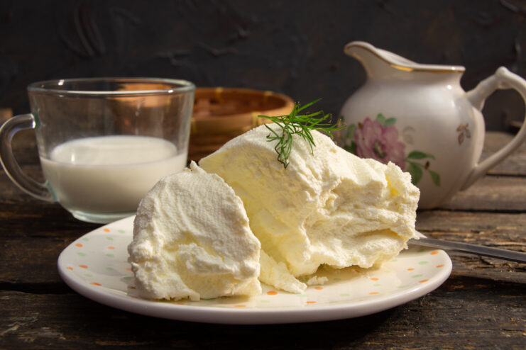 A bowl of homemade soft cream cheese made from sour cream, with a creamy texture.