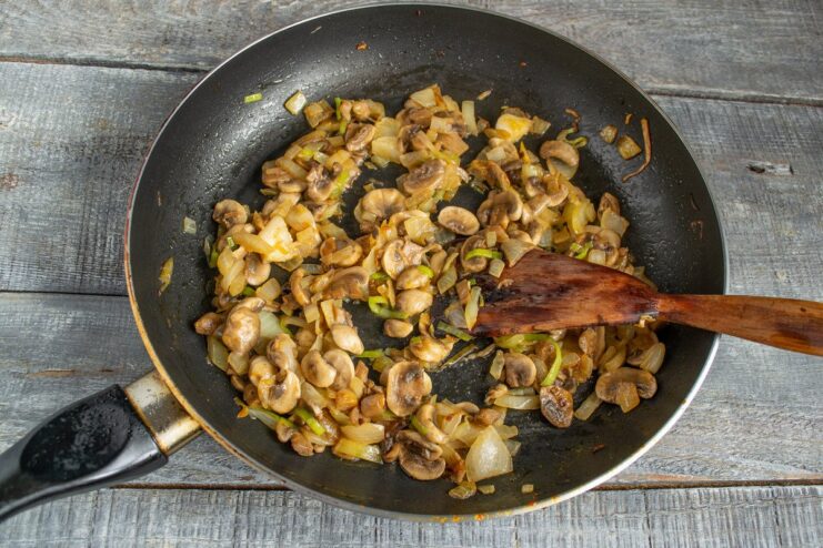 Cooling the Mushroom and Onion Mixture - An Important Step for the Farce A pan with cooked mushrooms and onions, set aside to cool down.