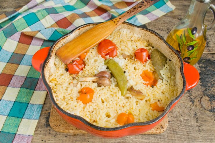 Simmering the Plov: Let the Magic Happen A covered Dutch oven simmering on the stove, cooking the plov for 45 minutes.