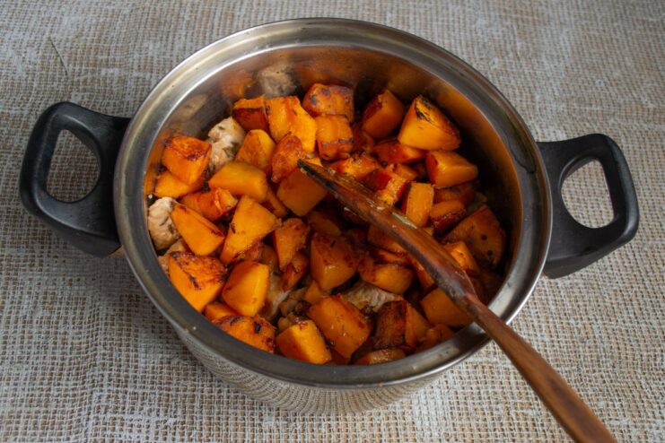 The Sweet Pumpkin Layer: Balancing the Flavors Golden-fried pumpkin cubes added as the next layer in the plov.