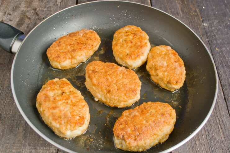 Frying Chicken Cutlets to a Perfect Golden Brown Chicken cutlets sizzling in a hot pan, being fried to a golden-brown crust.