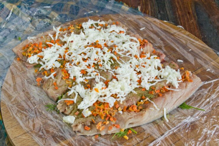 Adding a Layer of Grated Egg White to the Roulade A layer of finely grated hard-boiled egg white spread evenly over the mackerel.