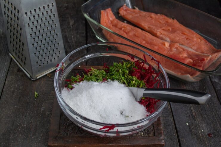 Mixing the Salt, Sugar, and Beetroot Cure A bowl with the gravlax cure mixture: grated beetroot, dill, coarse salt, and sugar.