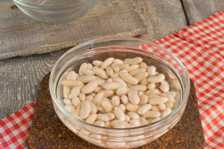Soaking and Cooking Beans - The First Step to a Perfect Stew Cooked white beans in a colander, ready for the stew.
