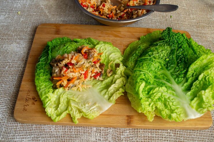 Step-by-step: How to fill the savoy cabbage leaves A portion of the rice and vegetable filling placed on a blanched savoy cabbage leaf.