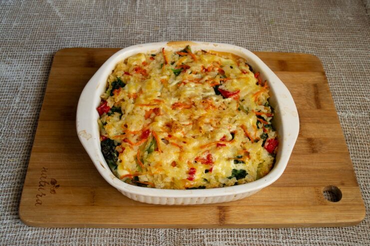 The Savoy cabbage gratin is ready when it's beautifully golden and bubbly. A perfectly baked vegetarian Savoy cabbage gratin fresh out of the oven.