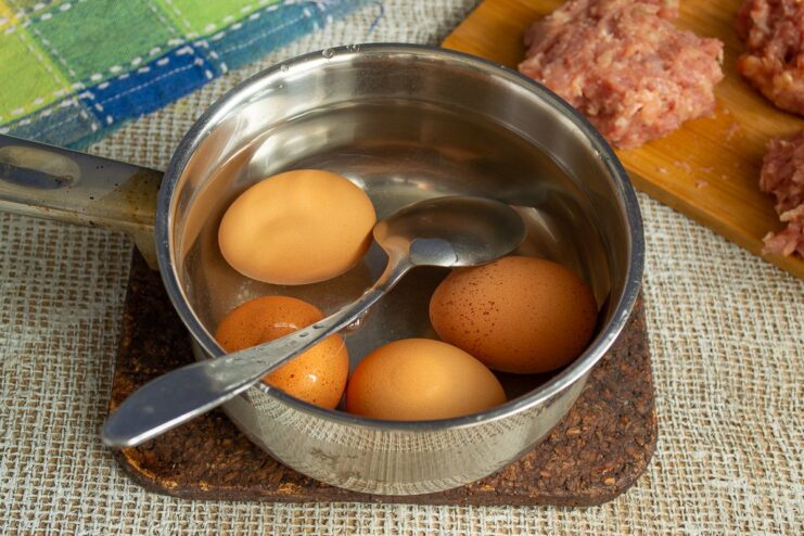 How to Soft-Boil Eggs for a Jammy Yolk Eggs being boiled in a pot of water to achieve a soft-boiled center.