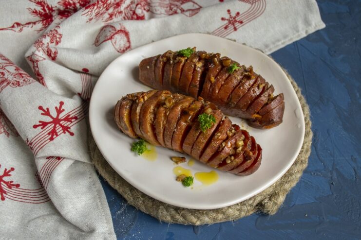 Finished Baked Sweet Potato with Honey and Nuts The finished baked sweet potato with honey and nuts, garnished and ready to serve.