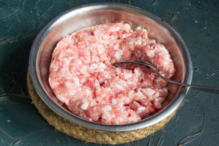 Preparing the Minced Meat Mixture for Zrazy A bowl of homemade minced meat mixture made from pork, beef, and pork fatback.