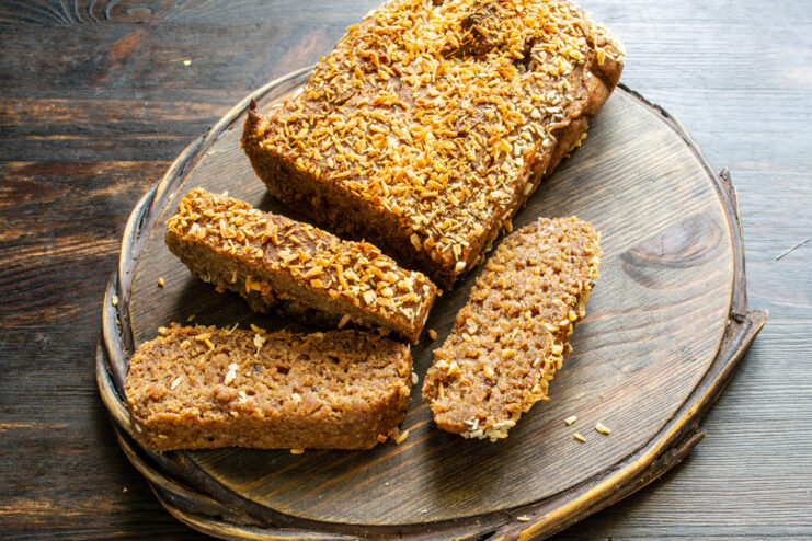 The perfect healthy breakfast: banana bread and coffee A slice of sweet banana bread served next to a cup of black coffee.