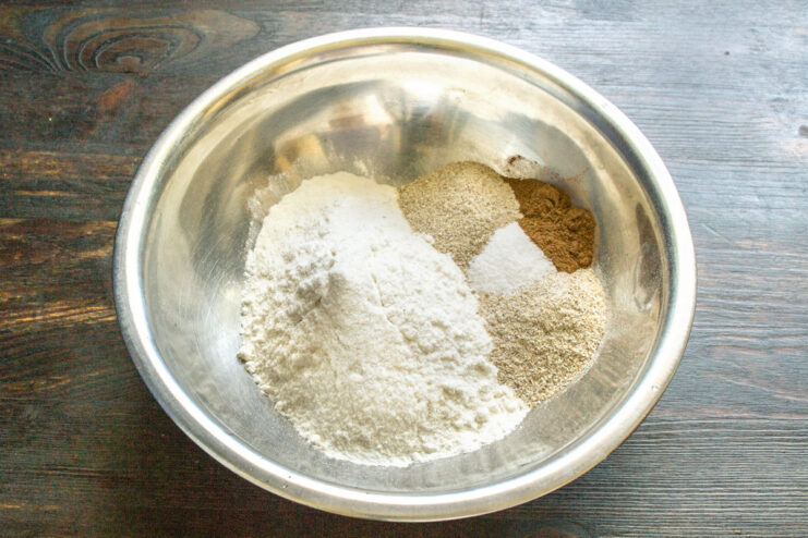 Measuring dry ingredients: rice and oat flour in a bowl A white bowl containing a mix of rice and oat flour.