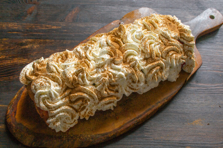 Let the Roll Chill Overnight for the Best Flavor. Enjoy! A beautifully decorated lemon and apple sponge roll, ready to be served after chilling.