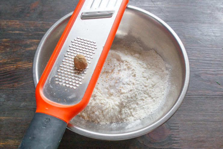 Step 2: Combining the dry ingredients for the buns. A white bowl containing flour, baking soda, and baking powder.