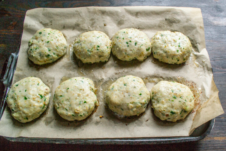 Step 7: Baking the chicken cutlets until cooked Golden-brown baked chicken cutlets on a parchment-lined baking sheet.