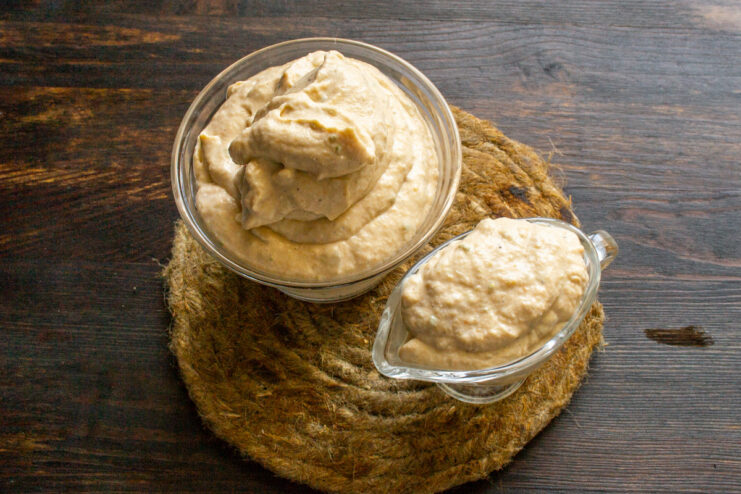 Chilling the Dip to Let Flavors Meld A bowl of the finished, smooth roasted vegetable and ricotta dip, ready to be chilled in the refrigerator.