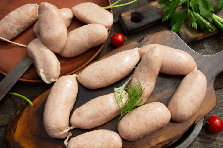 A plate of freshly made homemade chicken sardelki, linked and ready for cooking.