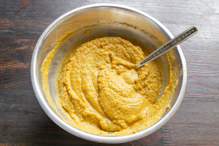 Adding Vinegar to Balance the Flavors Adding a tablespoon of vinegar to the mustard mixture in a glass bowl.