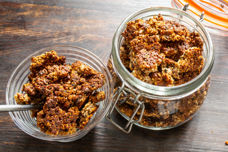 Storing Your Homemade Granola for Lasting Freshness Finished granola with quinoa stored in a clear glass jar with a lid.