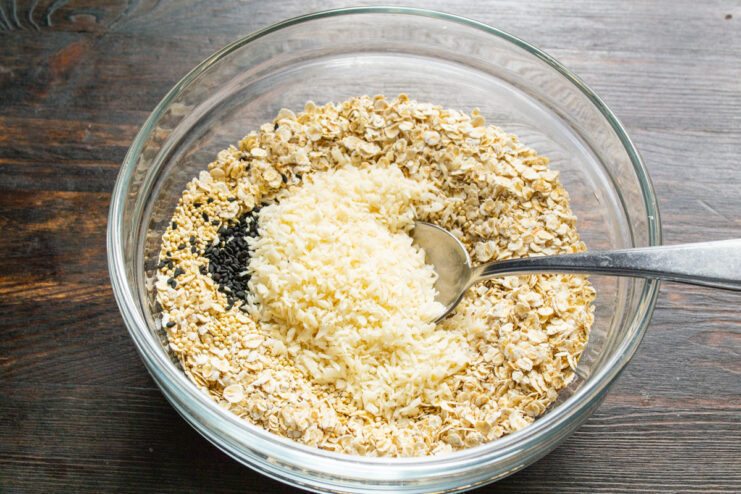 Adding Shredded Coconut for Tropical Flavor Adding a handful of shredded coconut to the bowl of dry ingredients.
