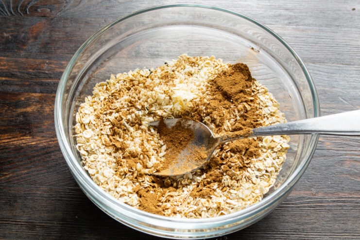 A Touch of Warmth: Adding Ground Cinnamon Adding a teaspoon of ground cinnamon to the granola mix.