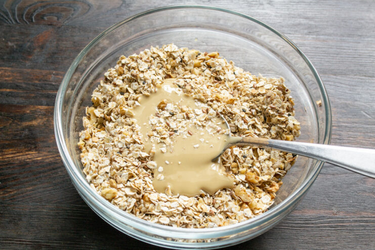 Binding it Together with Creamy Tahini Adding a spoonful of tahini (sesame paste) to the granola mixture.