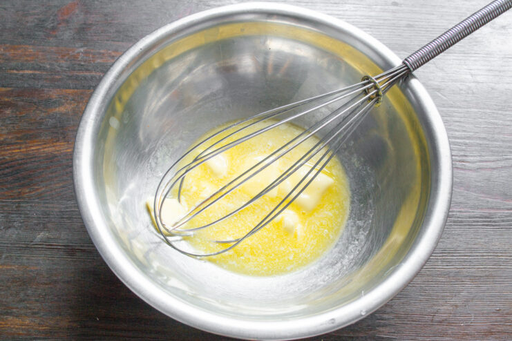 Softening Butter to the Perfect Consistency for Creaming A bowl of softened butter, ready to be mixed with sugar for the cupcake batter.