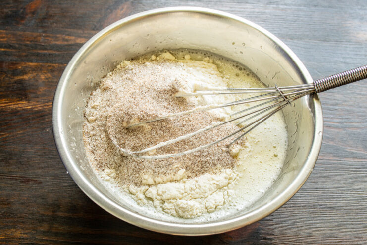 Using 3-in-1 instant coffee sachets is a quick way to add rich coffee flavor Adding instant coffee powder from a sachet into the muffin batter.