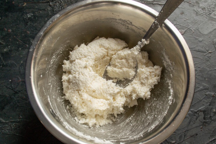 The Thick Consistency of the Finished Coconut Cookie Dough A bowl showing the thick, ready-to-use coconut cookie dough.