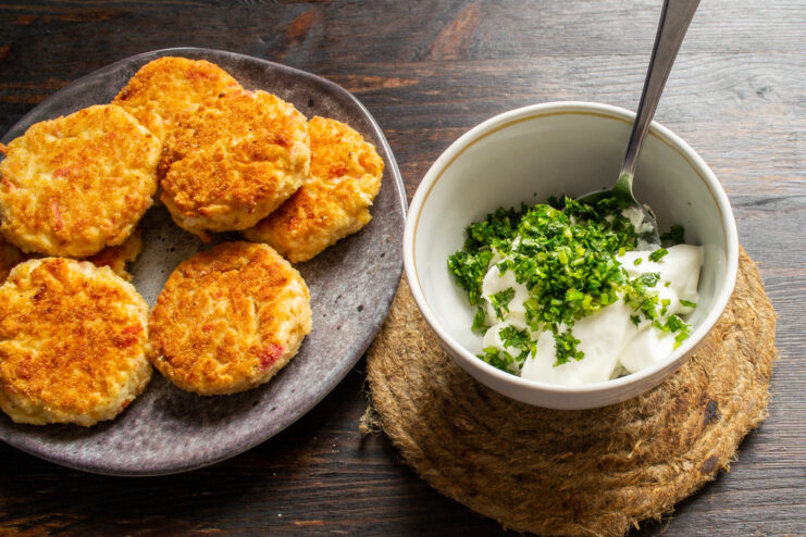 Making the Creamy Dipping Sauce - A simple mix of ricotta and smetana is the perfect pairing. A bowl showing ricotta cheese and smetana being mixed together for the sauce.