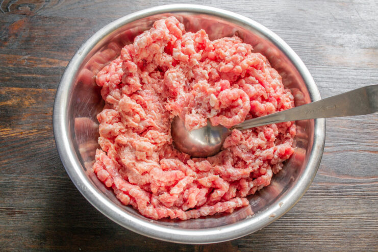 A bowl of fresh homemade ground meat, ready for making patties.