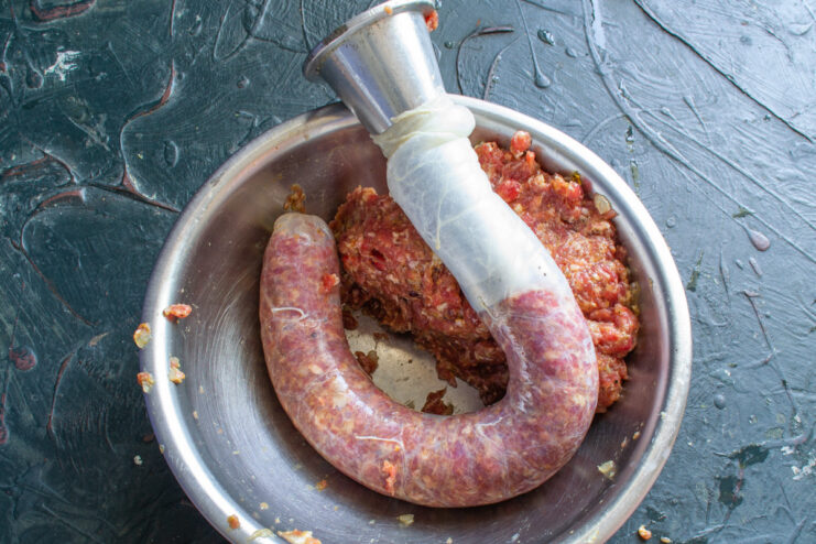 How to Hand-Stuff Sausage Casings for Homemade Kupaty Hand-stuffing the beef and pomegranate mixture into a natural pork casing.