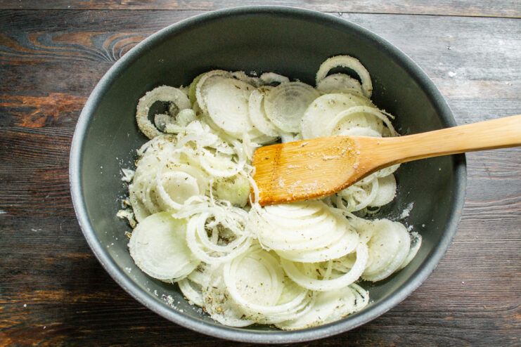 Simmering Onions Slowly for Jam Onions simmering gently in a skillet, becoming soft and translucent, not browned.