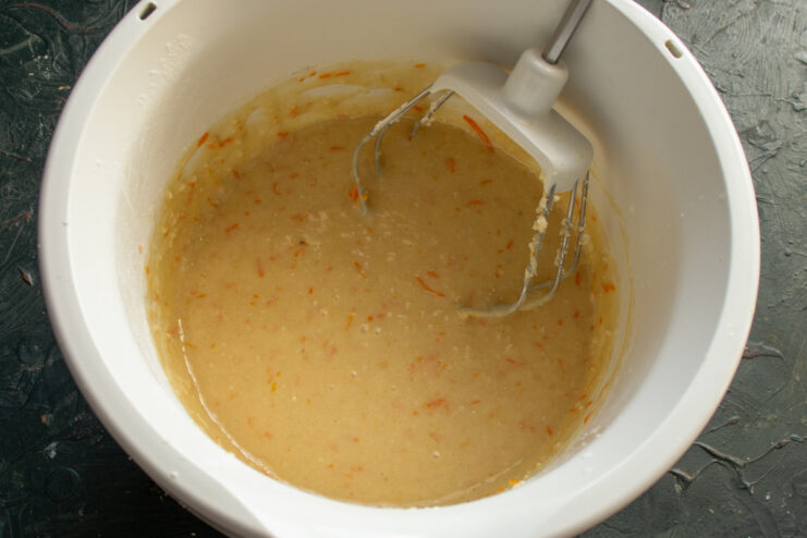 The final almond cake batter, mixed until smooth and homogeneous in a bowl.