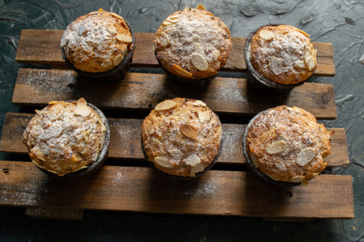 Cooling the freshly baked muffins properly. Golden-brown carrot muffins cooling on a wire rack after baking.
