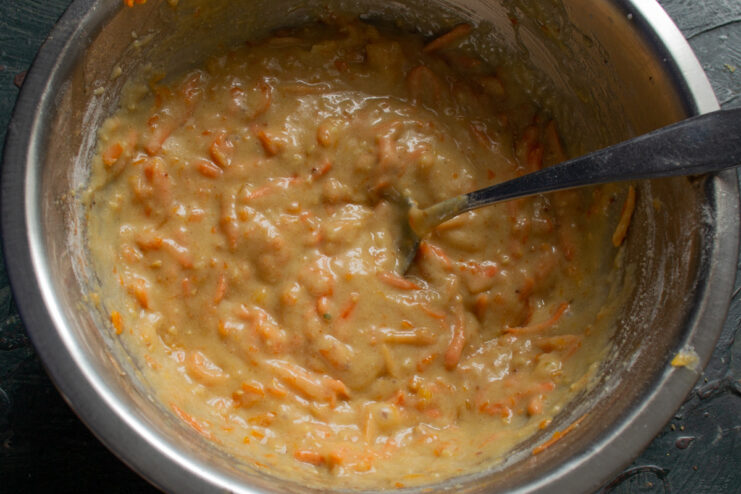 Resting the muffin batter for a better texture. A bowl of fully mixed carrot muffin batter, ready to rest.