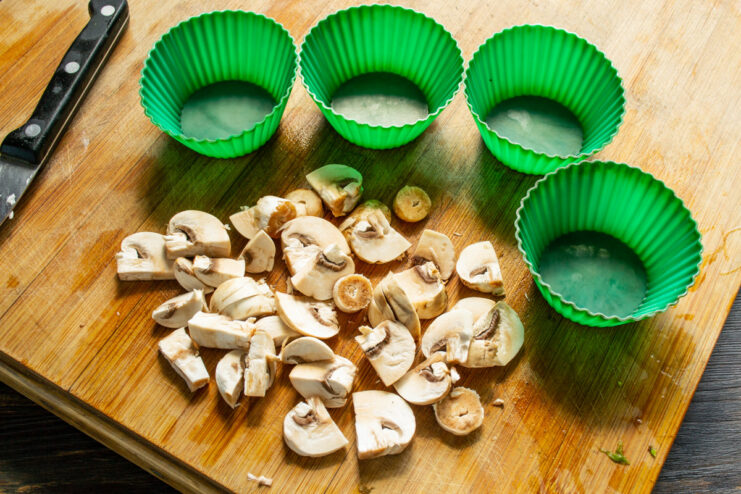 How to Properly Clean Mushrooms for Your Omelette Fresh champignons being washed and dried in a kitchen setting.