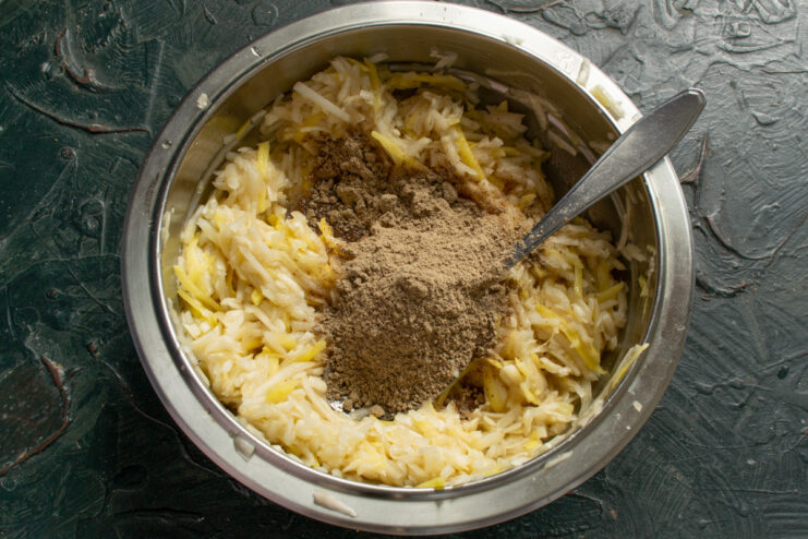 Adding flaxseed flour to the patty mixture for binding and extra nutrition. Sprinkling flaxseed flour into the bowl with the vegetable and egg mixture.