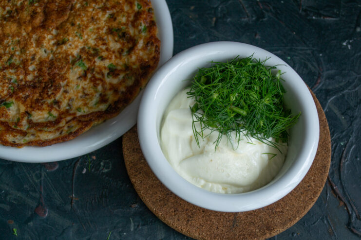Preparing the Creamy Dill Sauce Ingredients for the sauce - smetana and dill - in a container for blending.