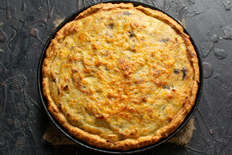 Step 10: Baking the mushroom and cheese pie to perfection The mushroom and cheese pie baking in the oven until the crust is golden.