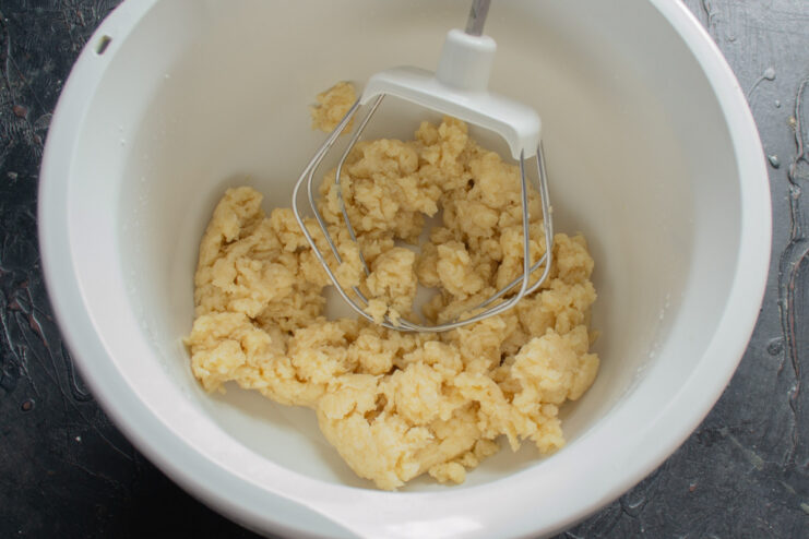 Step 3: Letting the pie dough rest before rolling A ball of smooth pie dough resting on a surface.