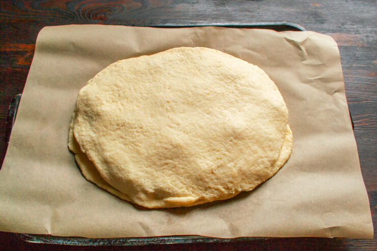 Preparing the Top Crust for the Pie Rolling out the second piece of dough for the top crust of the pie.