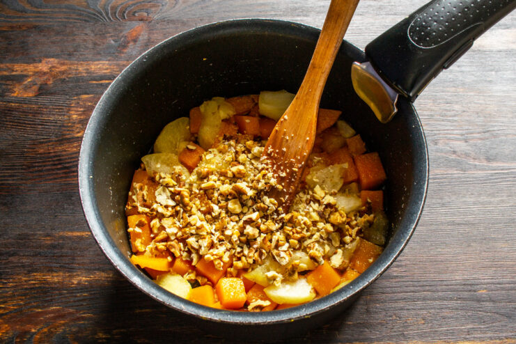 How to Prepare Walnuts for the Pie Filling Chopped walnuts in a small bowl, ready to be added to the pie filling.