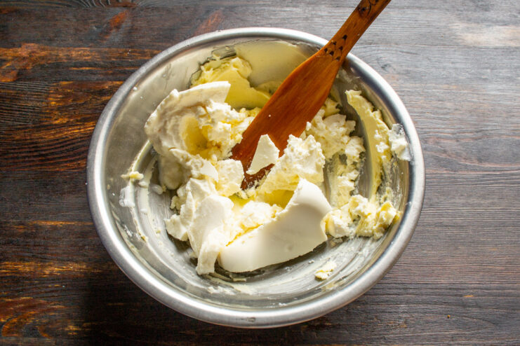 Adding Tvorog or Ricotta to the Dough Adding a scoop of soft cheese (tvorog or ricotta) to the butter and sugar mixture.