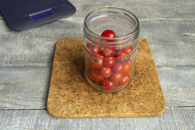 Choosing the Best Tomatoes for Pickling A bowl filled with fresh, small cocktail cherry tomatoes, perfect for canning.